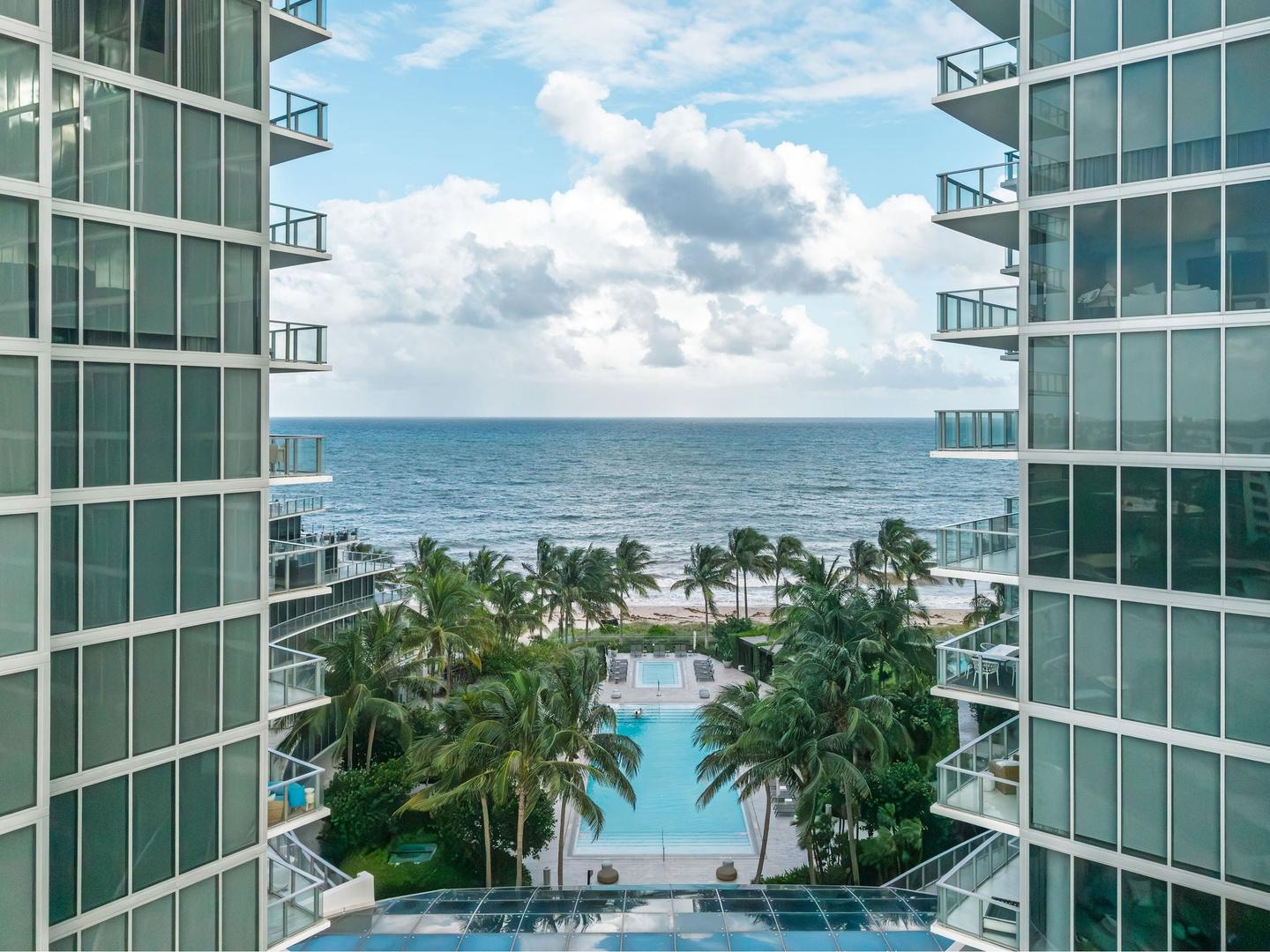 Resort amenity deck, pool, and shoreline aerial