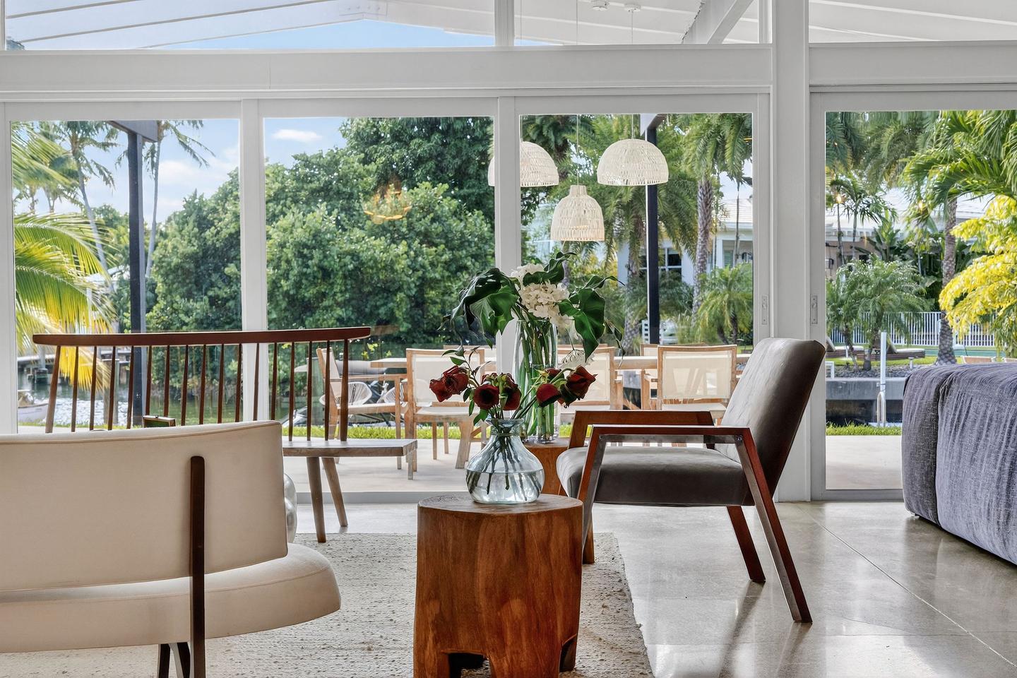 Living room with waterway and outdoor dining view