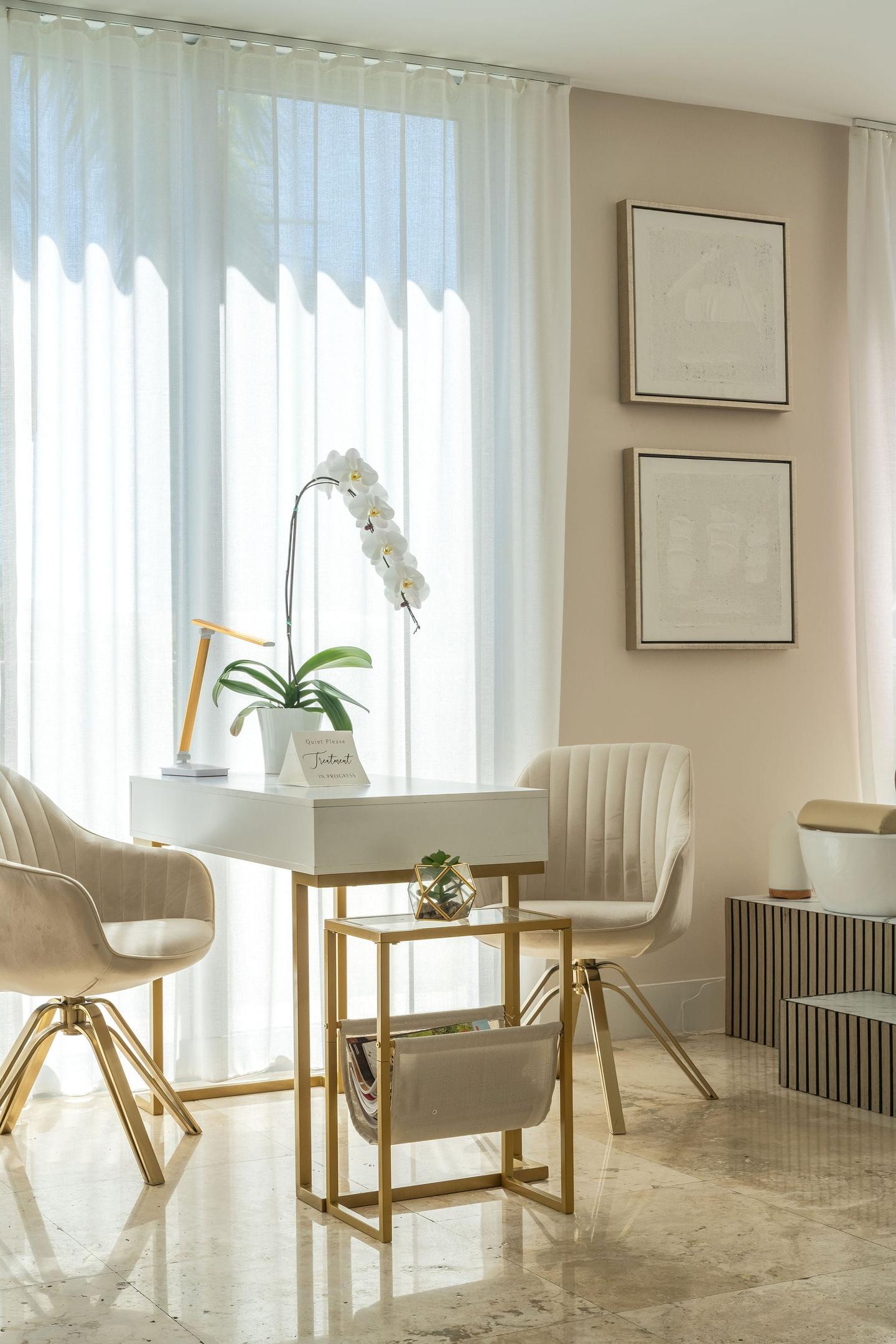 Spa treatment room with natural light and orchid styling