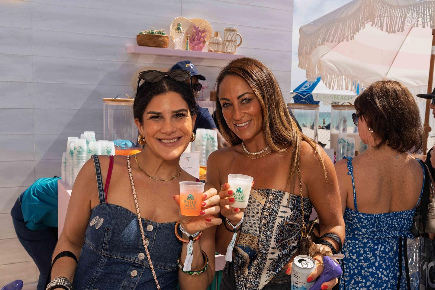 Festival attendees engaging with a branded beverage activation