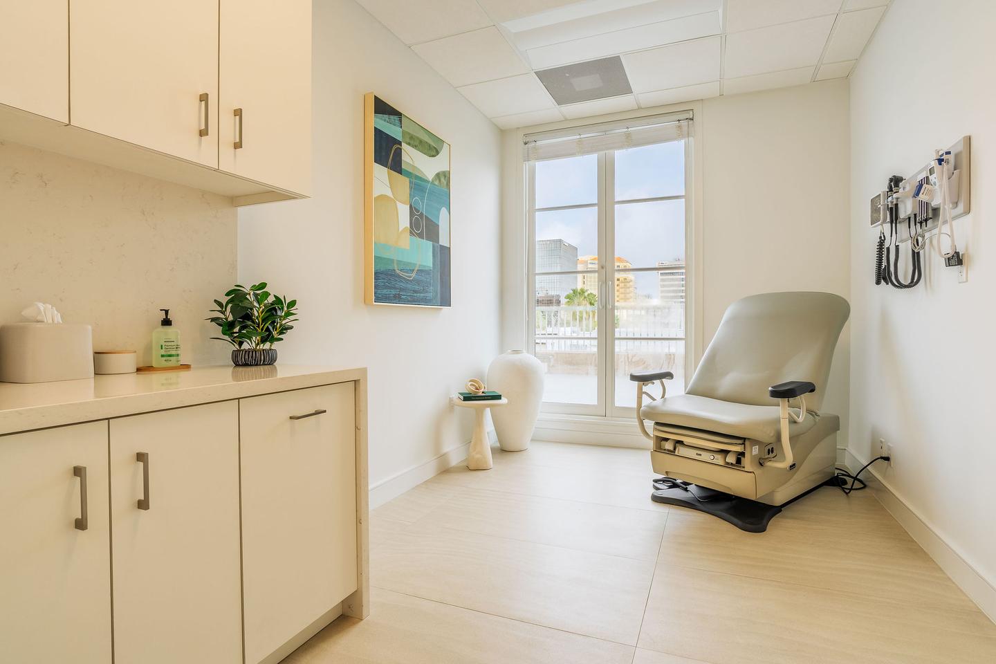 Editorial interior of an exam room with treatment chair and natural light